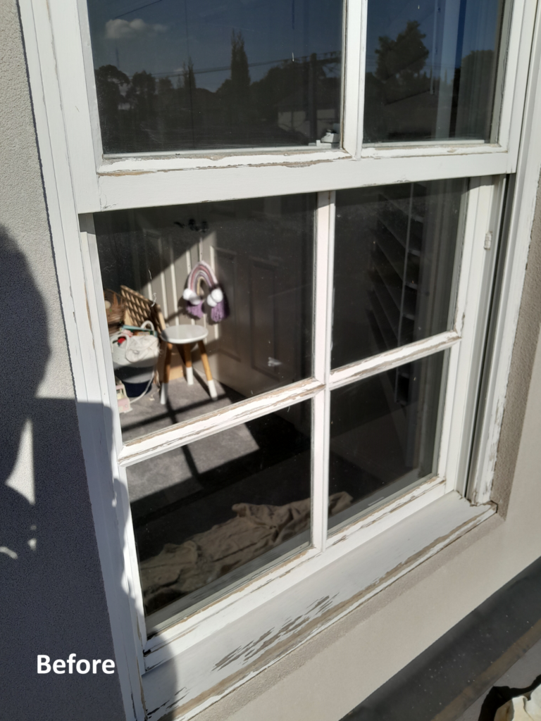 white window in disrepair.